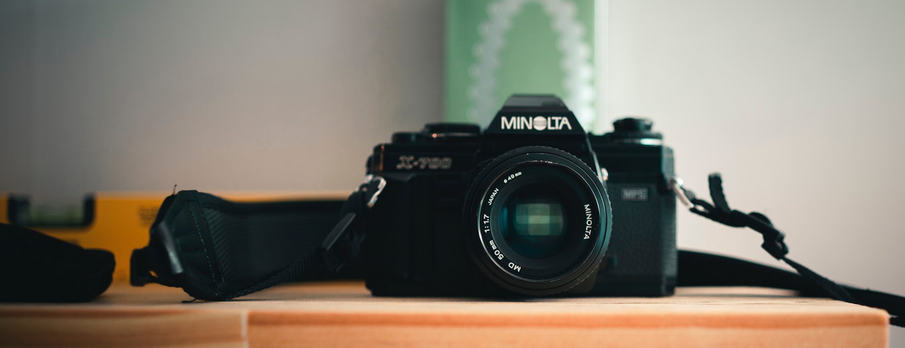 Photo by Long Tang: https://www.pexels.com/photo/photo-of-a-black-dslr-camera-on-a-wooden-surface-10312623/ Camera Repairs